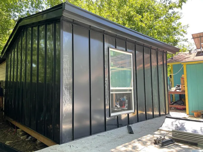 Black standing seam metal wall panels for Roof Inspection in North Haven